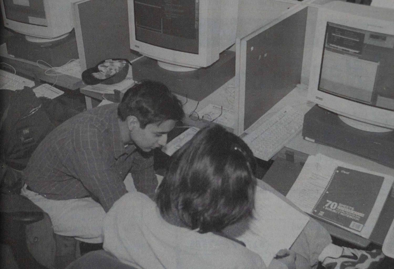 Two students study in the library during their final exams in 1997. Online educational tools have transformed Harvard academics.