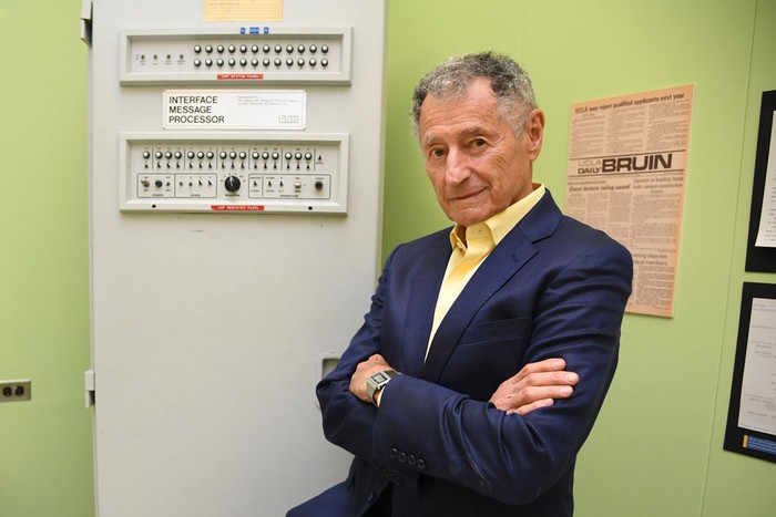 Leonard Kleinrock poses next to the first Interface Message Processor (IMP) in the laboratory where the first Internet message was sent, at the University of California at Los Angeles.  Photo credit: Robyn Beck/AFP via Getty Images